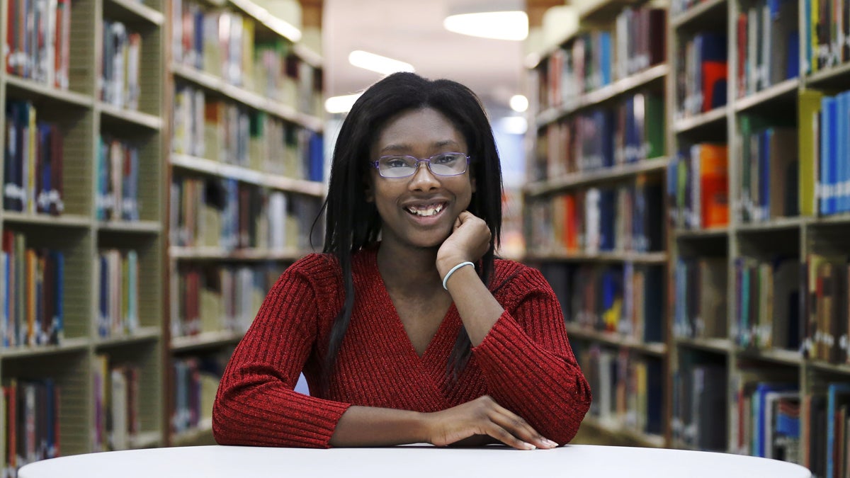 Octavia Coaks poses for a portrait at the Olive-Harvey College library in Chicago in 2015. The idea of free community college has been touted by Democrats and Republicans. Chicago offers the Star Scholarship. The idea is to curb student debt and boost employment by removing cost from the equation. But offering free community college isn't supported by everyone.  (AP file Photo/Charles Rex Arbogast)