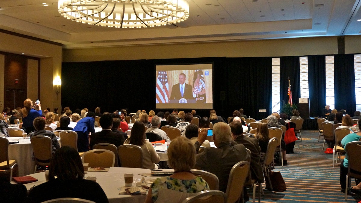  Those attending the annual meeting of the National Association of Area Agencies on Aging watched President Obama give a speech as part of Monday's White House Conference on Aging. (Jessica McDonald/WHYY) 