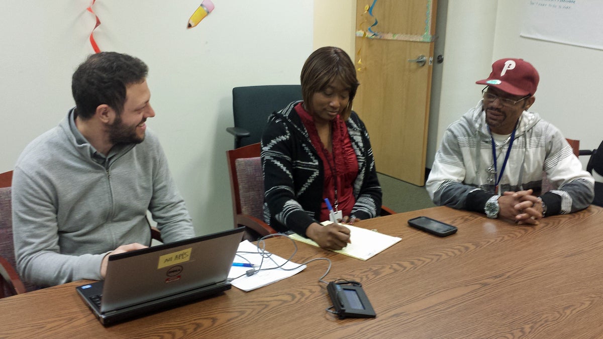  Recovery coaches Ben Goldstein and LaVonna Reed work with program participant John Hamm. (Erme Maula/Mental Health Association of SE Pennsylvania) 