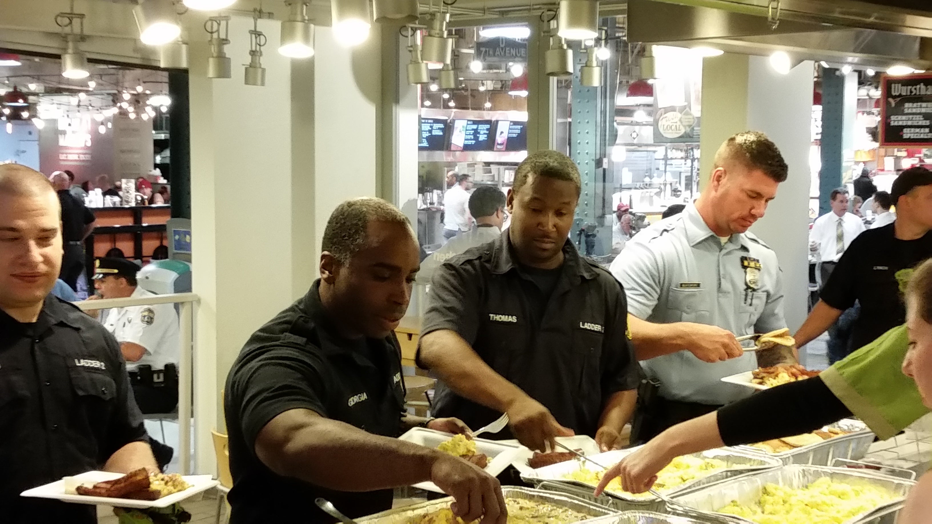  First responders who worked Amtrak crash enjoy breakfast at Reading Terminal Market (Tom MacDonald/WHYY) 