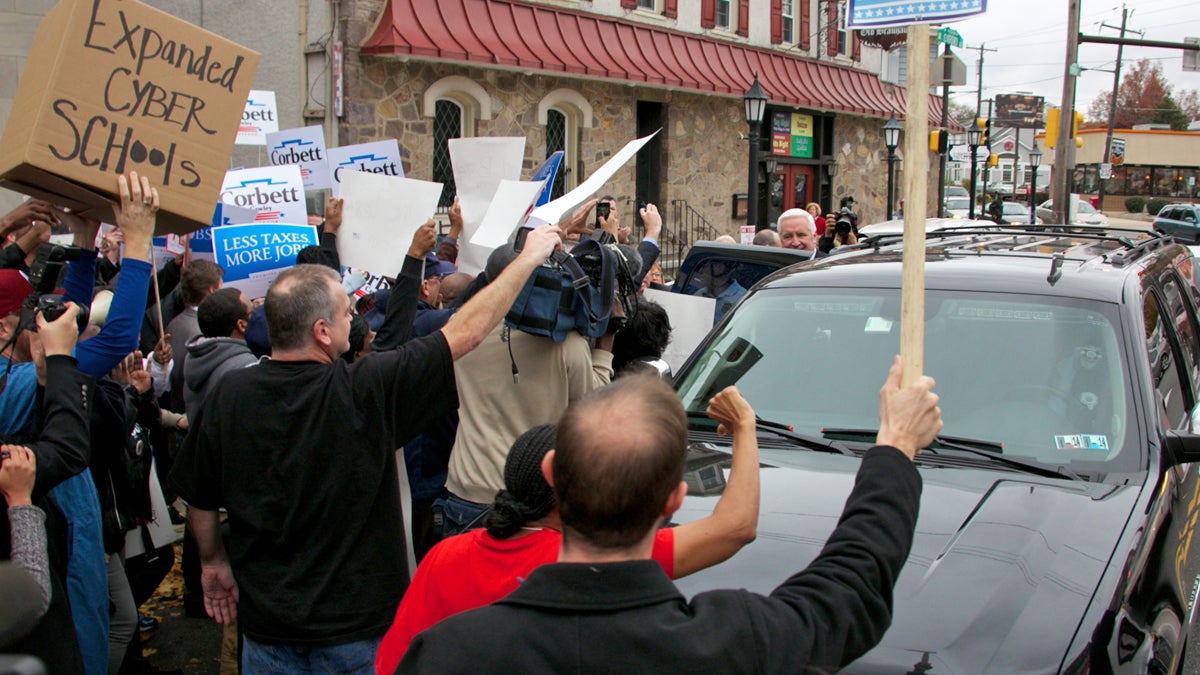  School protesters and supporters surround Pa. Governor Tom Corbett during his visit to Philadelphia on Thursday, November 7, 2013. (Nathaniel Hamilton/For Newsworks) 