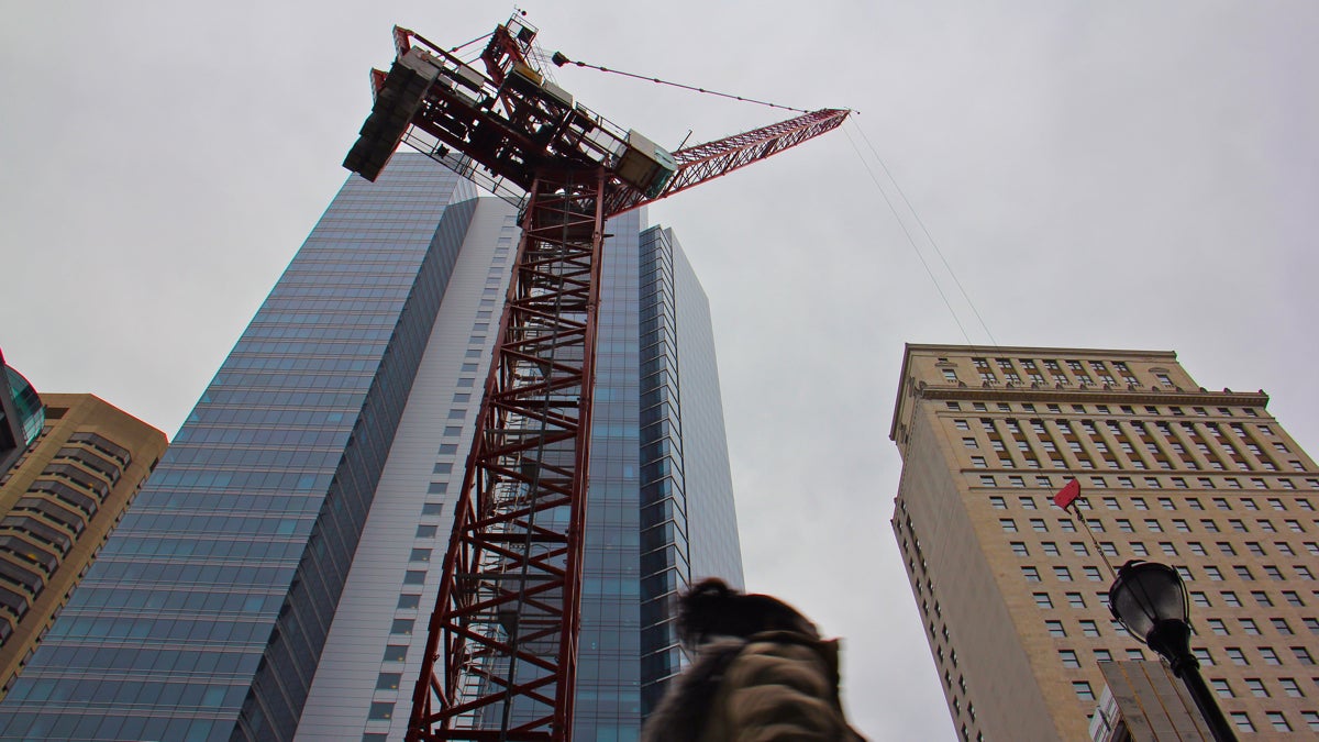 A large crane looms over the 1400 block of Chestnut Avenue.