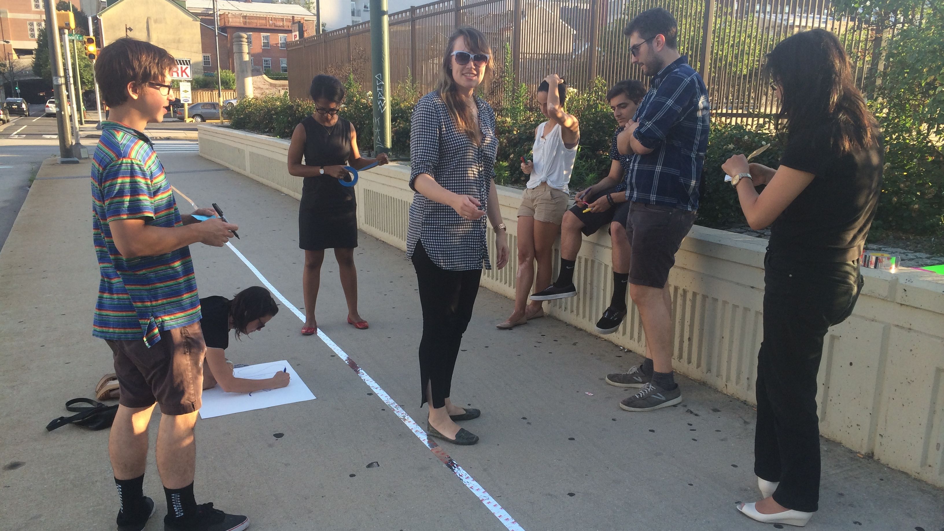  Volunteers for the League of Creative Interventionists lay out a 'slow lane' in Philadelphia. (Photo courtesy of Hunter Franks) 