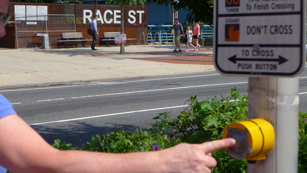  The only effect the button at the Race Street/Columbus Boulevard crosswalk seems to have is to frustrate pedestrians and encourage them to cross unsafely. (Image courtesy of Steve Perzan)  
