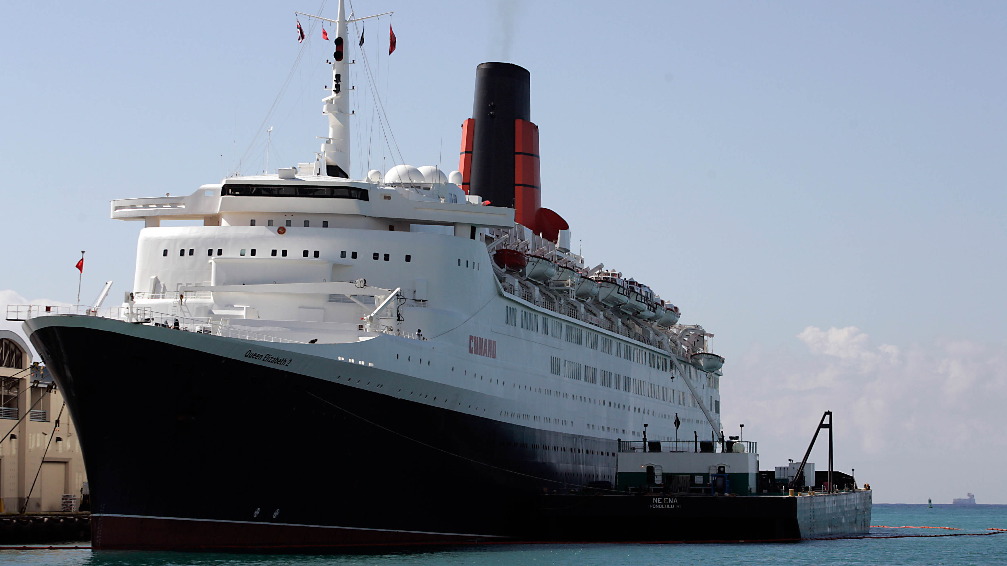 The Queen Elizabeth 2 docked at Honolulu Harbor in 2007. Federal public health officials boarded the ship to examine a stomach flu outbreak on the ship. The Centers for Disease Control and Prevention reported 276 passengers and 28 crew members had come down with norovirus. (AP Photo/Marco Garcia)