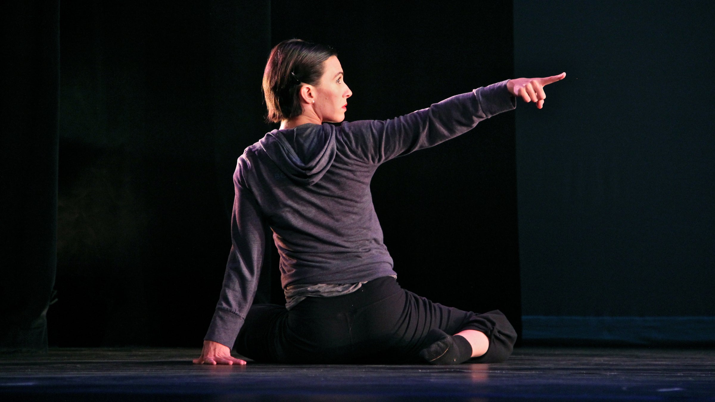Tina Finkelman Berkett,cofounder and co-artistic director for the Los Angeles-based dance company BODYTRAFFIC, rehearses for the group's performance at the Prince Theater. (Emma Lee/WHYY)