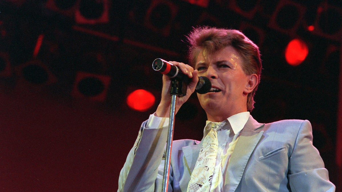 David Bowie is shown performing Wembley Stadium in London in 1985. (AP Photo/Joe Schaber)
