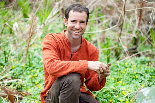 Urban forager David Siller prospects for springtime edibles on the Reading Viaduct. (photo courtesy Fair Food)