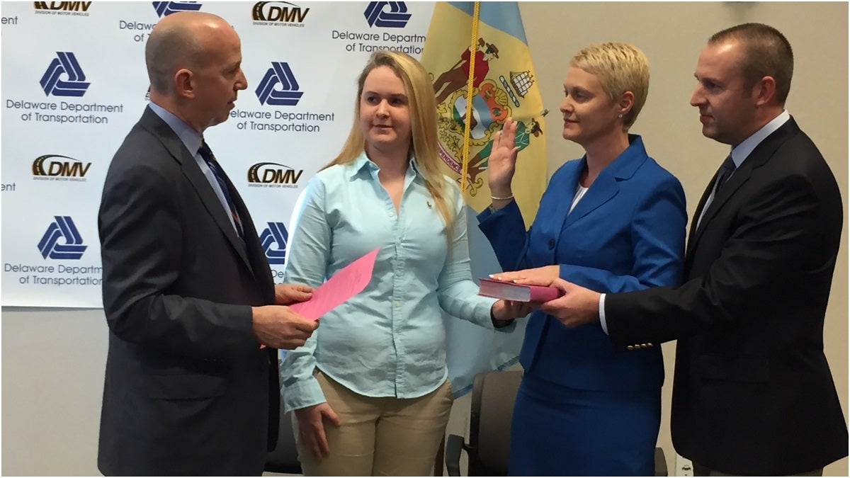  Former Del. DMV Director Jennifer Cohan was sworn in as state's 10th secretary of transportation by Gov.Jack Markell. Cohan's husband Chris and daughter Brittany join her.(Paul Parmelee/WHYY) 