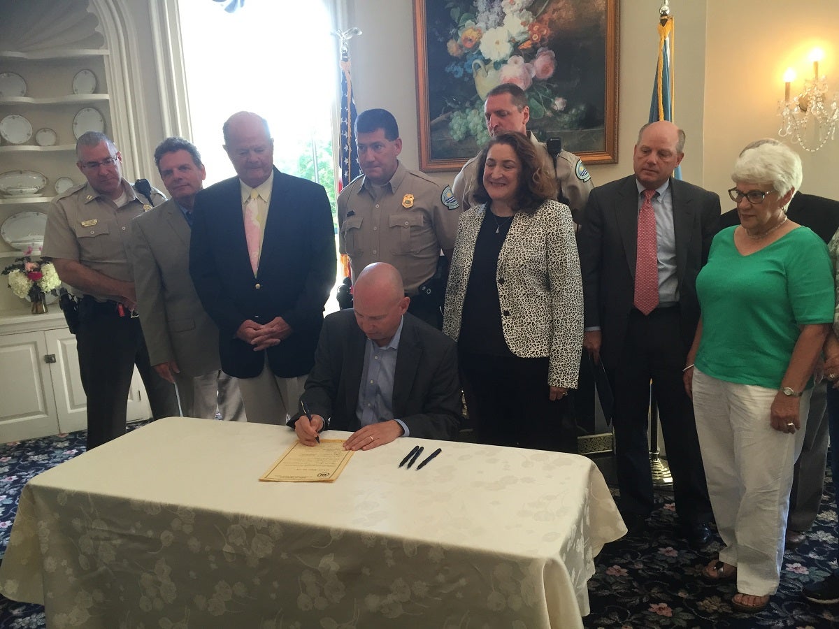  Governor Markell signs Senate Bill 114, which declassifies a number of minor violations associated with Delaware State Parks. (Zoe Read/Newsworks) 