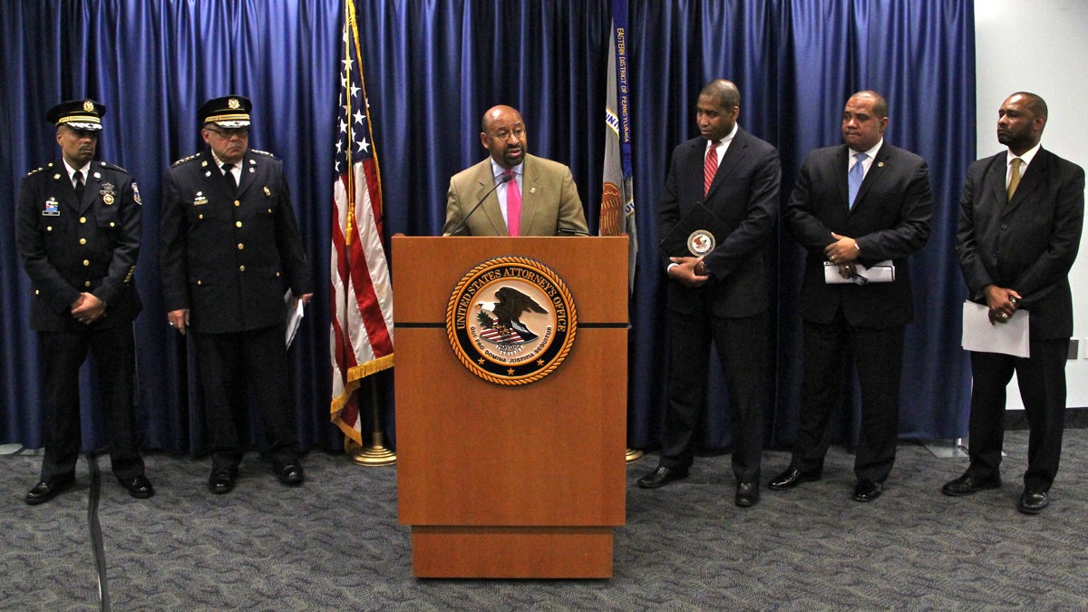  Mayor Michael Nutter responds to a Justice Department assessment of the Philadelphia Police department use of force. With him are Deputy Commissioner Richard Ross, Commissioner Charles Ramsey, U.S. Attorney Zane Memeger, Ronald Davis, director of the Office of Community Oriented Policing Services, and former Madison Police Chief Noble Wray. (Emma Lee/WHYY) 
