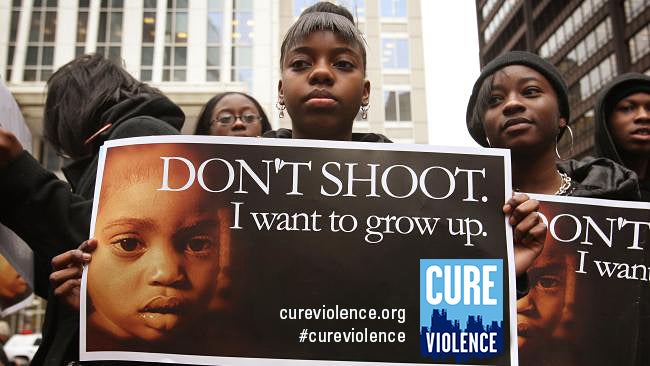  How can we have a conversation about gun violence? Some people say to treat it like a disease. (Courtesy of Cure Violence) 