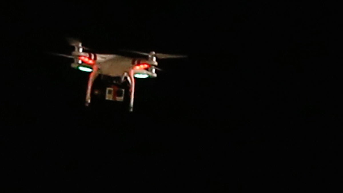  A flying drone with a camera hanging from it flies over PNC Park during a baseball game between the Pittsburgh Pirates and the New York Mets.  (AP Photo/Keith Srakocic) 