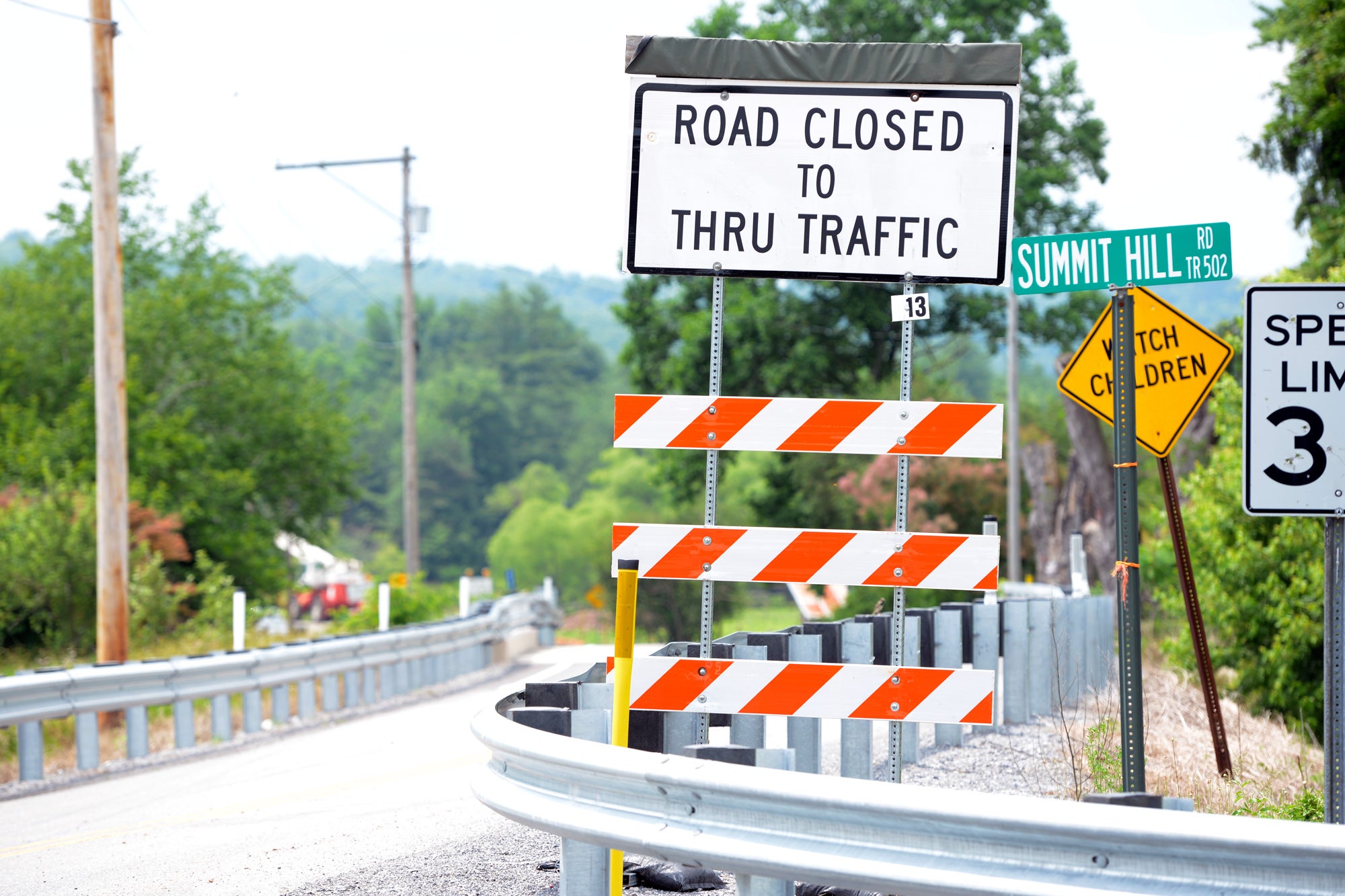  Pennsylvania Infrastructure Report Card: A sign warns traffic about a bridge under construction about a mile ahead; access to the area will be limited again when another bridge a few miles later is slated to be replaced next year. (Kelly Tunney/For WPSU) 