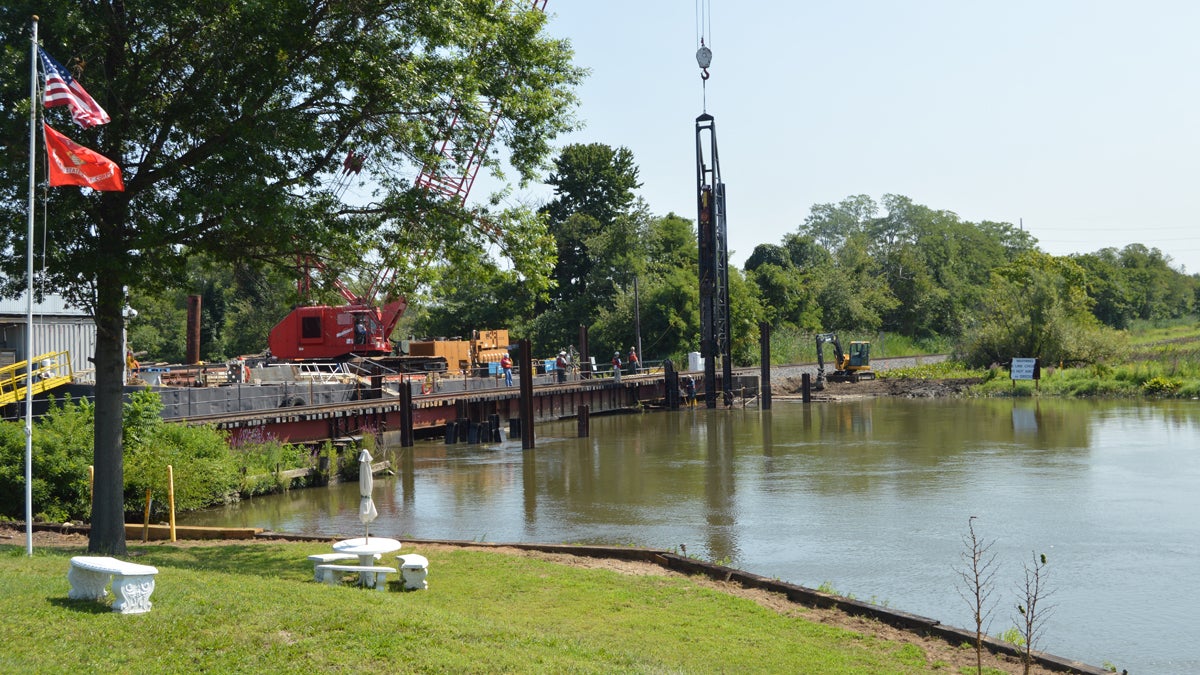  Work continues Thursday on a new rail bridge at the site of the 2012 Conrail derailment.(Tom MacDonald/ WHYY) 