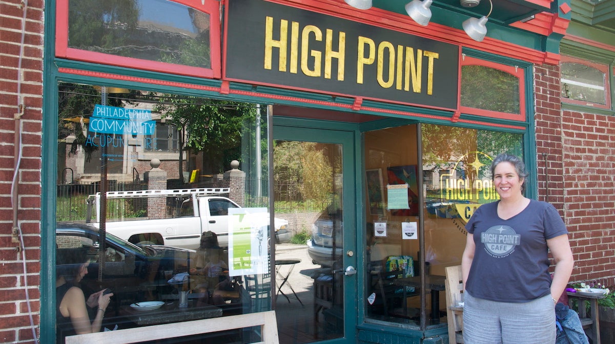  Meg Hagele stands in front of High Point Cafe on Carpenter Lane. (Greta Iverson/for NewsWorks) 