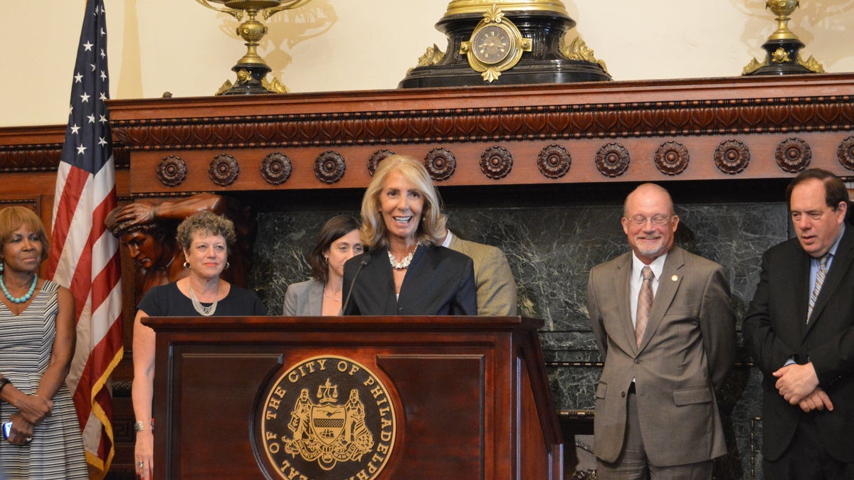  Letizia Amadini-Lane, a vice president with GlaxoSmithKline, speaks in favor of the new law signed Wednesday by Mayor Michael Nutter. (Tom MacDonald/WHYY) 