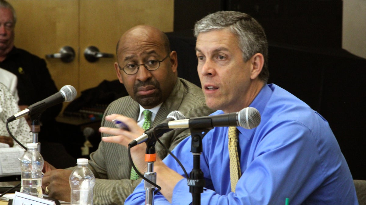  U.S. Secretary of Education Arne Duncan, right, and Philadelphia Mayor Michael Nutter host a roundtable discussion on President Obama’s My Brother’s Keeper initiative Friday in Philadelphia, listening to a dozen young men of color share their experiences. (Emma Lee/WHYY) 