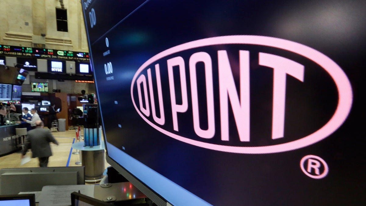  The company name of DuPont appears above its trading post on the floor of the New York Stock Exchange. (AP Photo/Richard Drew) 