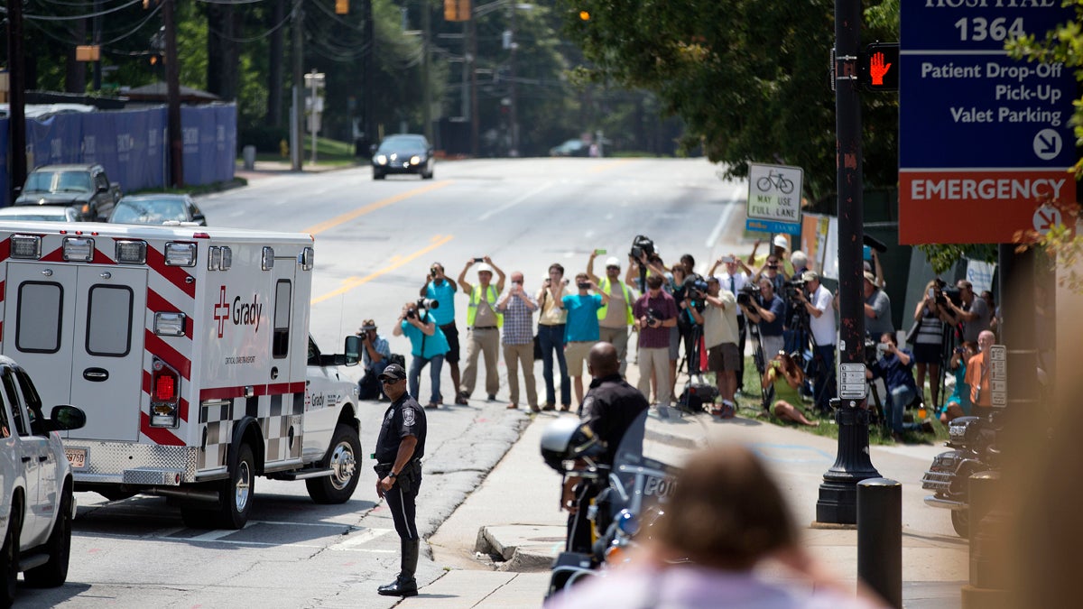  An ambulance transporting Nancy Writebol, an American missionary stricken with Ebola, is shown arriving at Emory University Hospital, Tuesday, Aug. 5, 2014, in Atlanta. (AP Photo/David Goldman) 