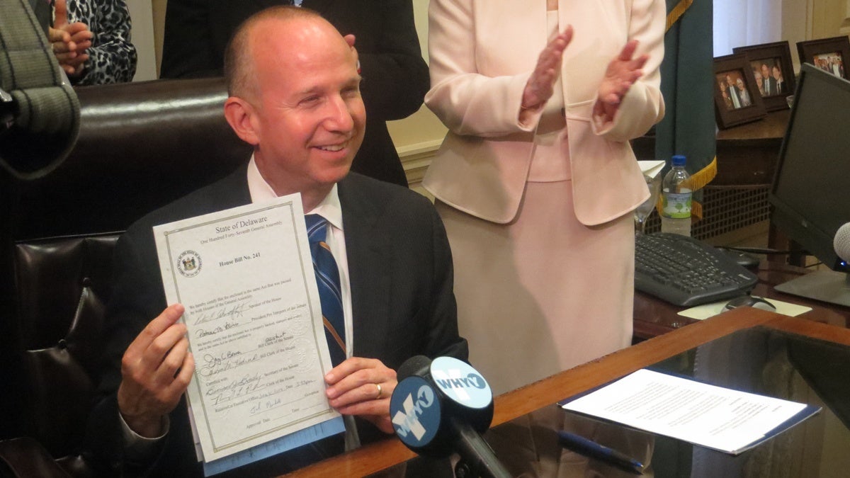 Gov. Jack Markell with House Bill 241 (Shana O'Malley/for NewsWorks) 