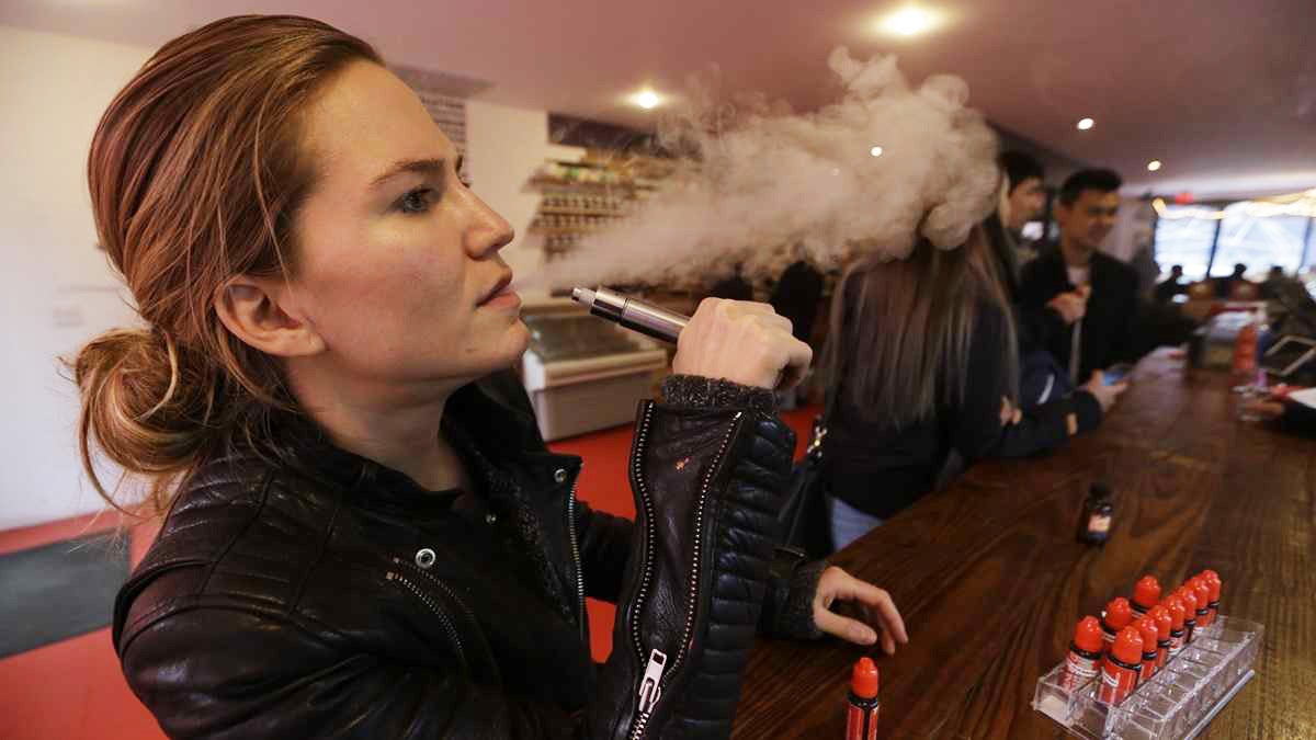  In this Feb. 20, 2014 photo, Talia Eisenberg, co-founder of the Henley Vaporium, uses her vaping device in New York. (AP Photo/Frank Franklin II) 