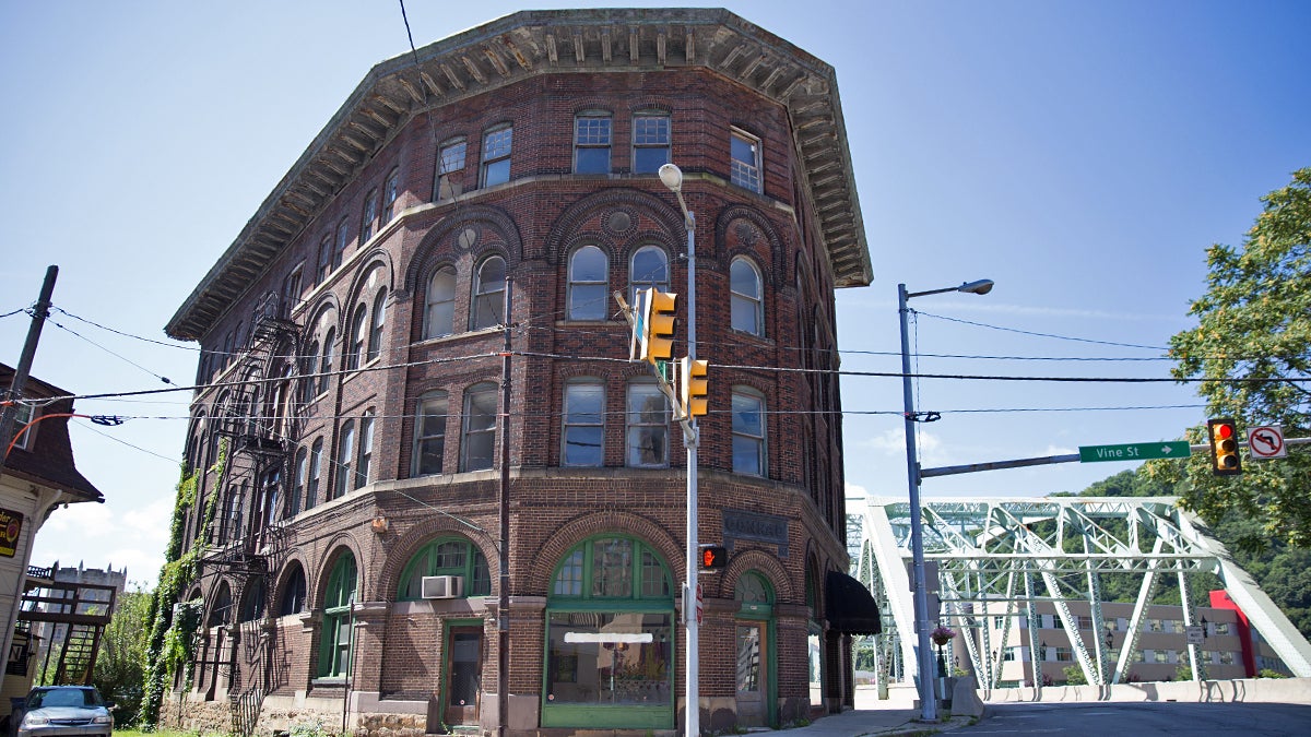  The flatiron Conrad building sits on the edge of the Stonycreek River in Johnstown, Pa. The building has become a symbol of the city's blight and economic struggles. (Lindsay Lazarski/WHYY) 