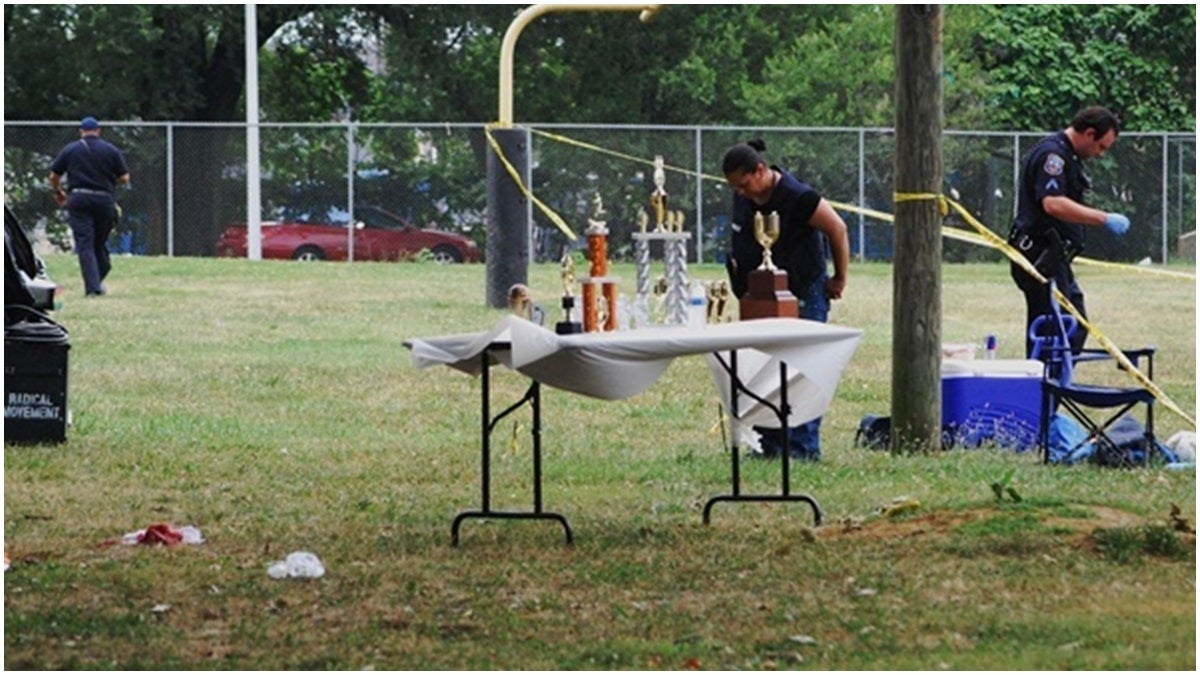  Investigators canvas the park for bullets following the deadly shooting on July 8, 2012. (John Jankowski/for NewsWorks) 