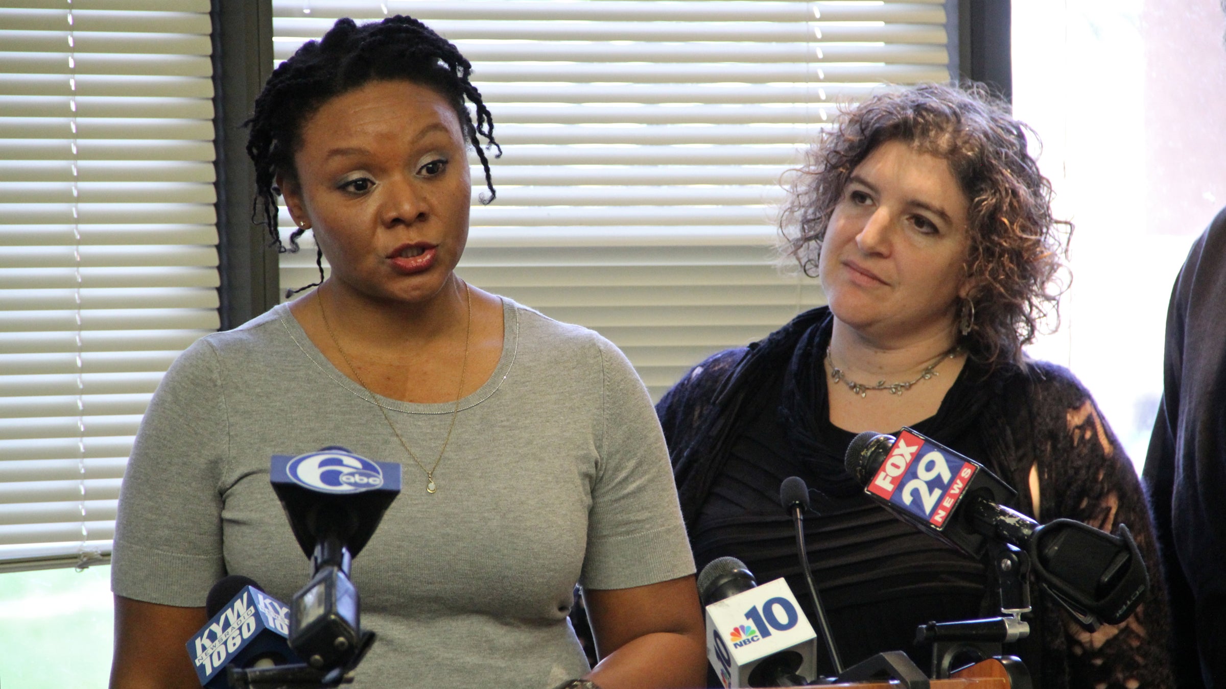  Robin Roberts (left), accompanied by Amy Laura Cahn of the Public Interest Law Center,  talks about deficiencies in Philadelphia public schools that led her to file complaints. (Emma Lee/WHYY) 