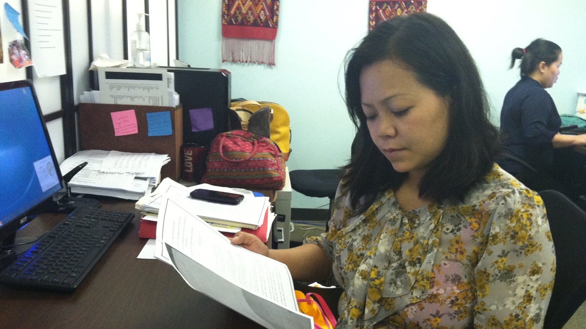  SEAMAAC outreach worker Zing Thluai has been helping people who receive notices submit requested immigration documents. She says some are confused, as they’d already submitted documents and are unsure whether their application is cleared. (Elana Gordon/WHYY) 