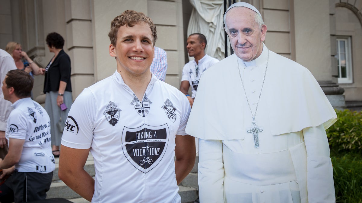 Domink Wegiel stands with a cut out of Pope Francis after another sucessful completion of the Biking4Vocations 1,400 mile ride from Florida to New York to raise awareness of priest vocations. Emily Cohen/for Newsworks