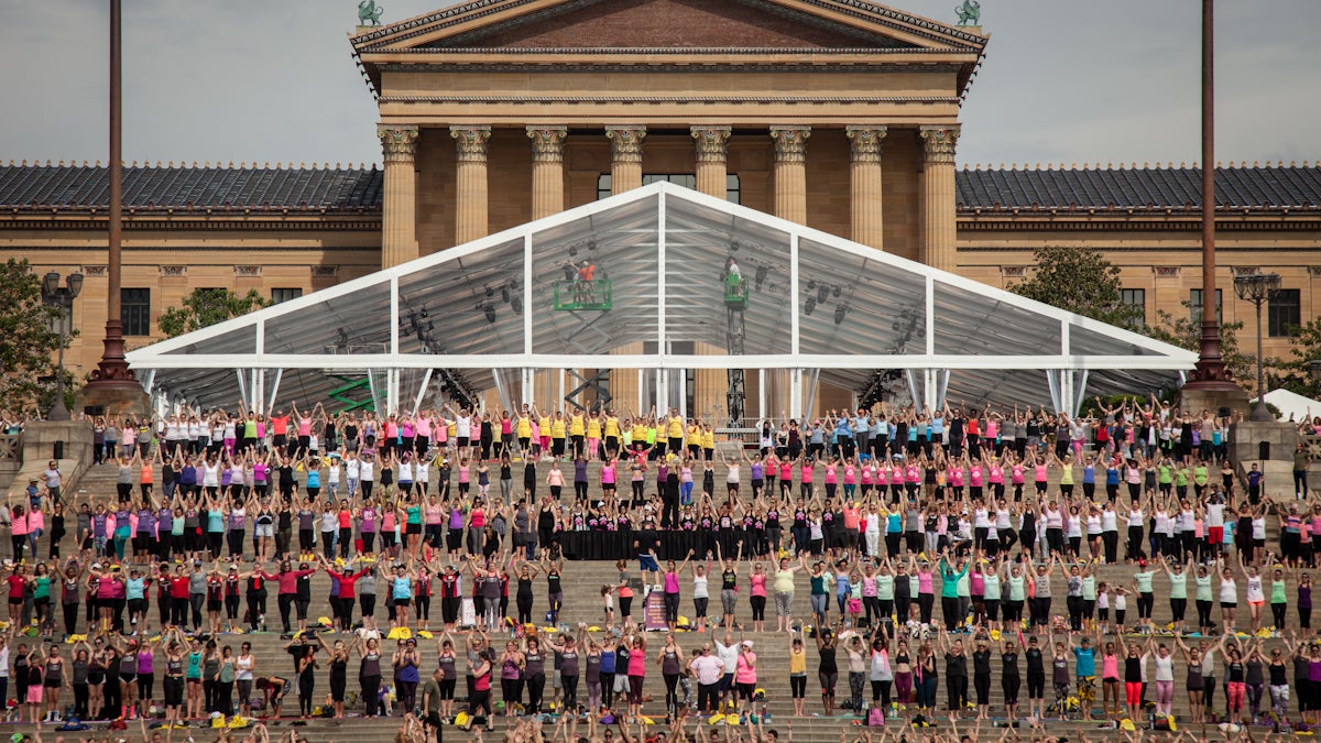 Over 2,000 partisipants came out to support Living Beyond Breast Cancer's Yoga on the Steps doubling last year's number and spilling out past the iconic Philadelphia Art Museum steps and onto the closed off parkway. Emily Cohen / For Newsworks