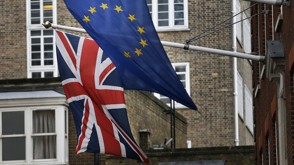 A European Union flag is shown hanging beside the Union Jack at the Europa House in London. (AP Photo/Frank Augstein)