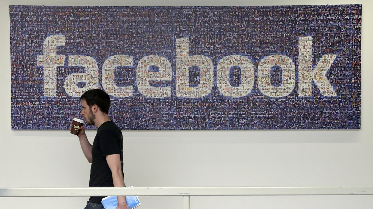 facebook_1200x675-1 A Facebook employee is shown walking past a sign at Facebook headquarters in Menlo Park