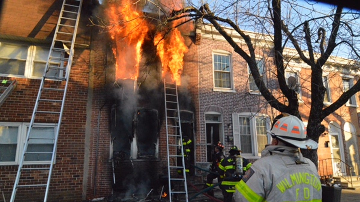  Two young girls were killed as fire ripped through a Wilmington row home on Monroe St. Tuesday afternoon. (John Jankowski/for NewsWorks) 