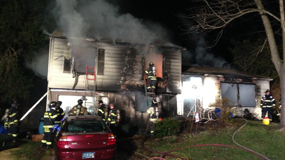  Firefighters work to contain the fire at a Newark home. One man was killed in the early Monday morning fire. (John Jankowski/for NewsWorks) 