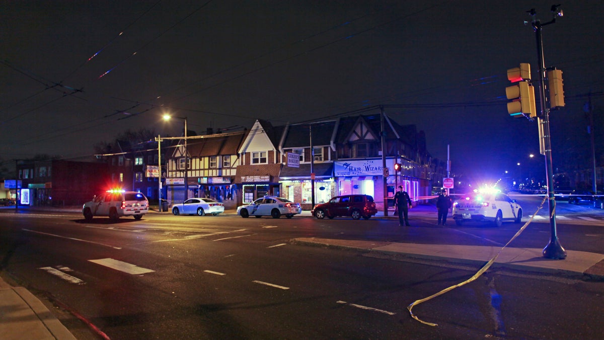  Investigators gather at the scene of a fatal shooting in the Mayfair section of Philadelphia. (AP Photo/ Joseph Kaczmarek) 