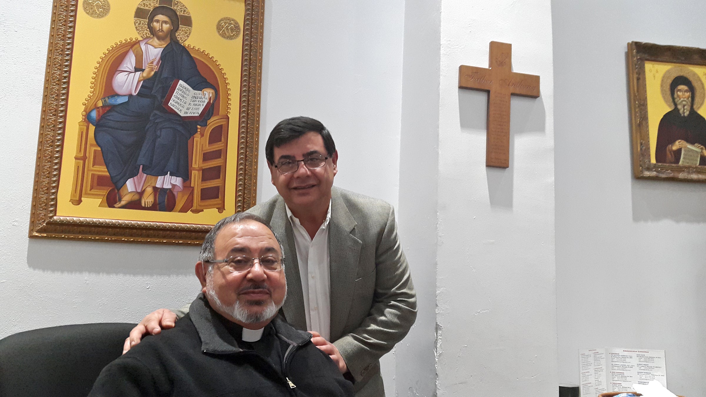  The Rev. Anthony Sabbagh and his brother Nasser Sabbagh work at St. George Antiochian Orthodox Church in Allentown, a Syrian Christian church founded in 1916. The church is providing aid to Syrian refugees in the Lehigh Valley and in Syria. (Laura Benshoff/WHYY) 