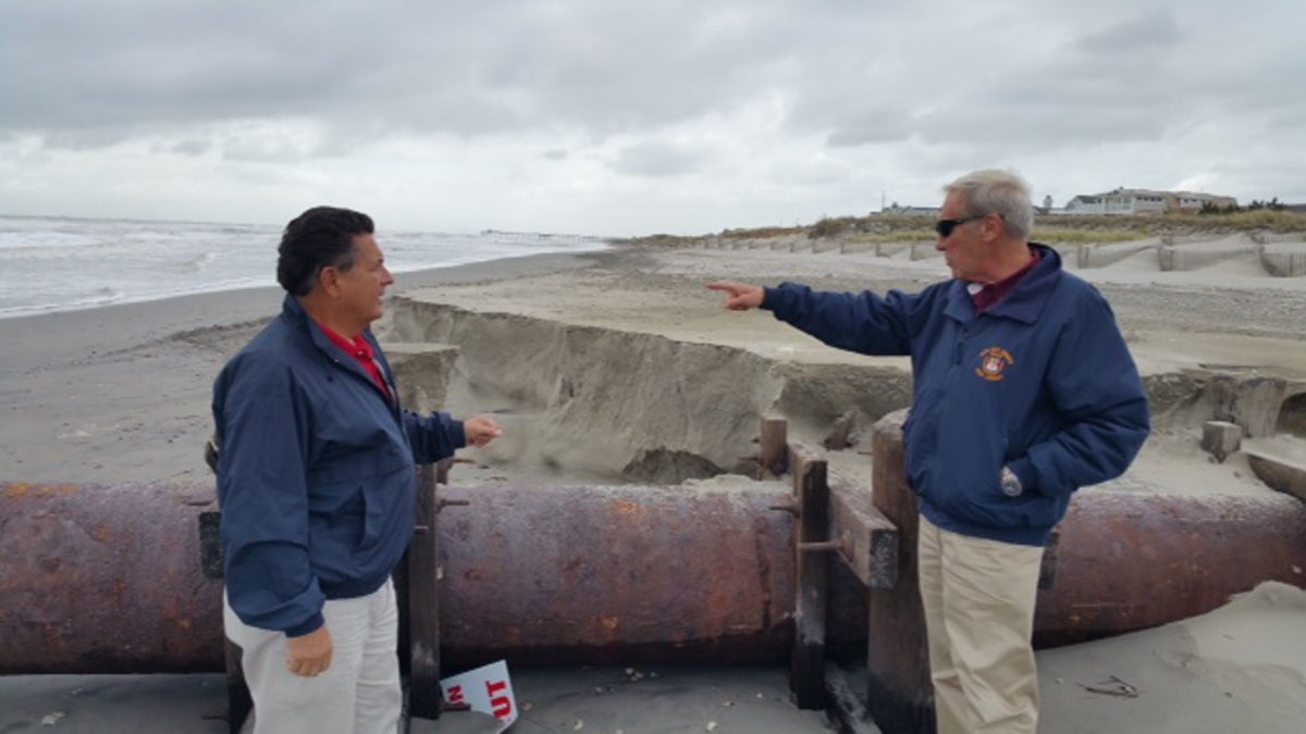  Assemblyman Sam Fiocchi, left, and Cape May County Emergency ManagementCoordinator Martin Pagliughi inspect beach erosion from thenor'easter in Avalon Monday morning. (Phil Gregory/WHYY) 