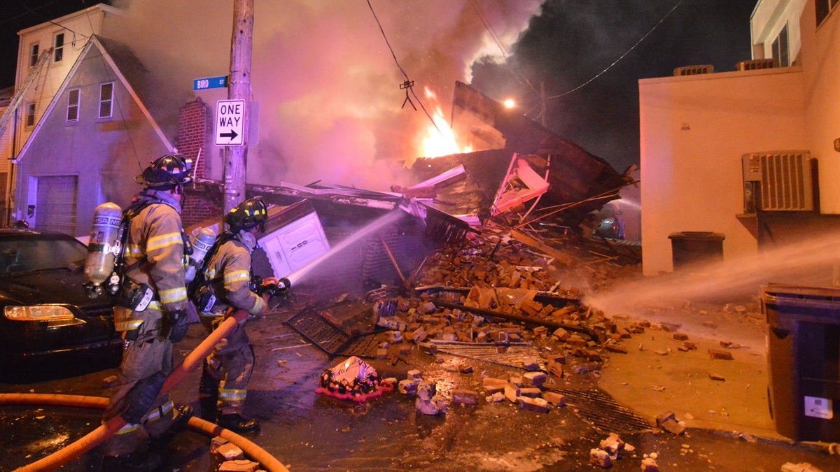  Firefighters work to extinguish the fire on Bird St. in Wilmington. (John Jankowski/for NewsWorks) 