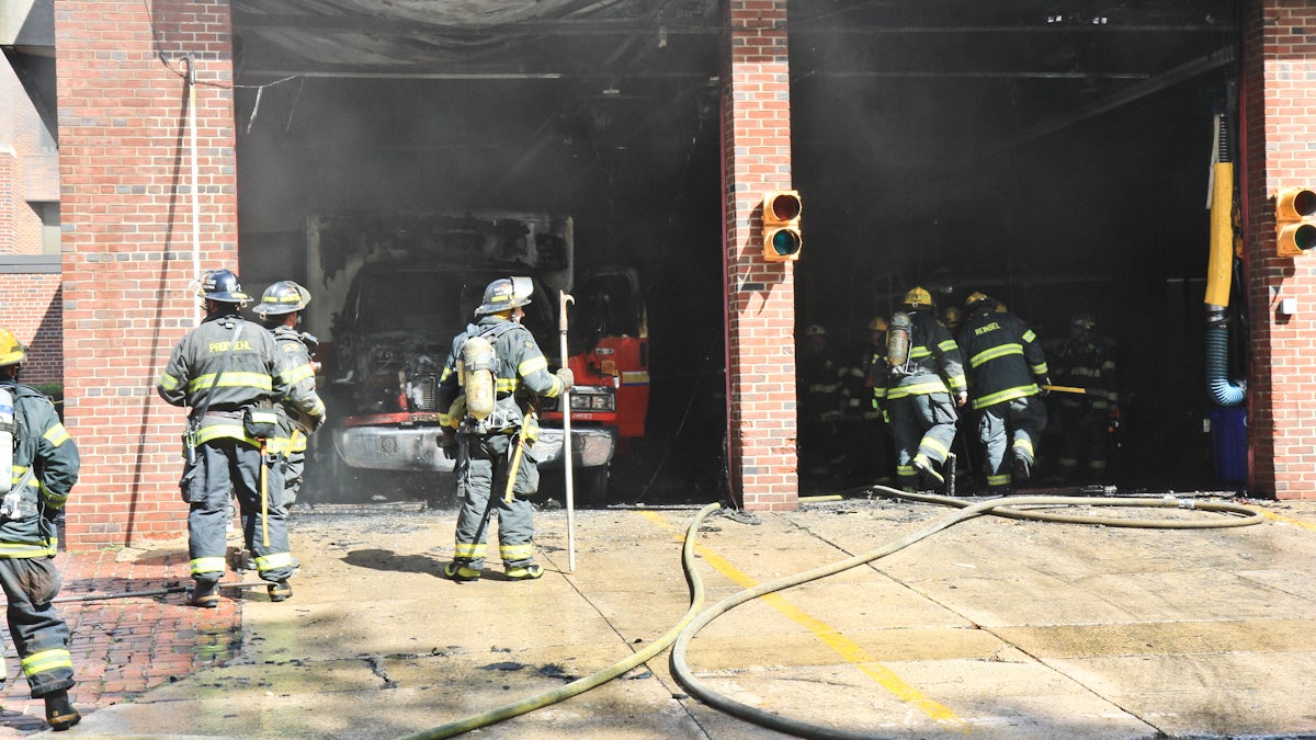  A medic unit caught fire Friday, Sept. 27, 2013 at Fourth and Arch streets where it was stored.  (Kimberly Paynter/WHYY) 