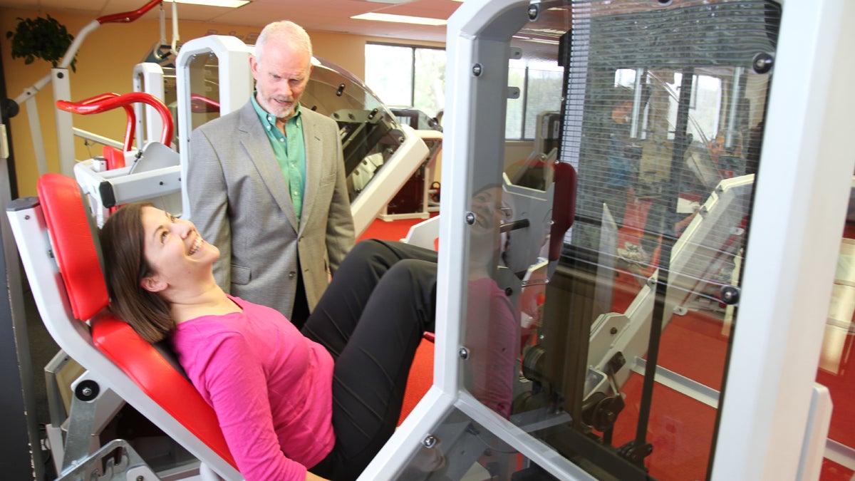 Pulse host Maiken Scott tests out one of the X- force fitness exercises with Dr. Ellington Darden