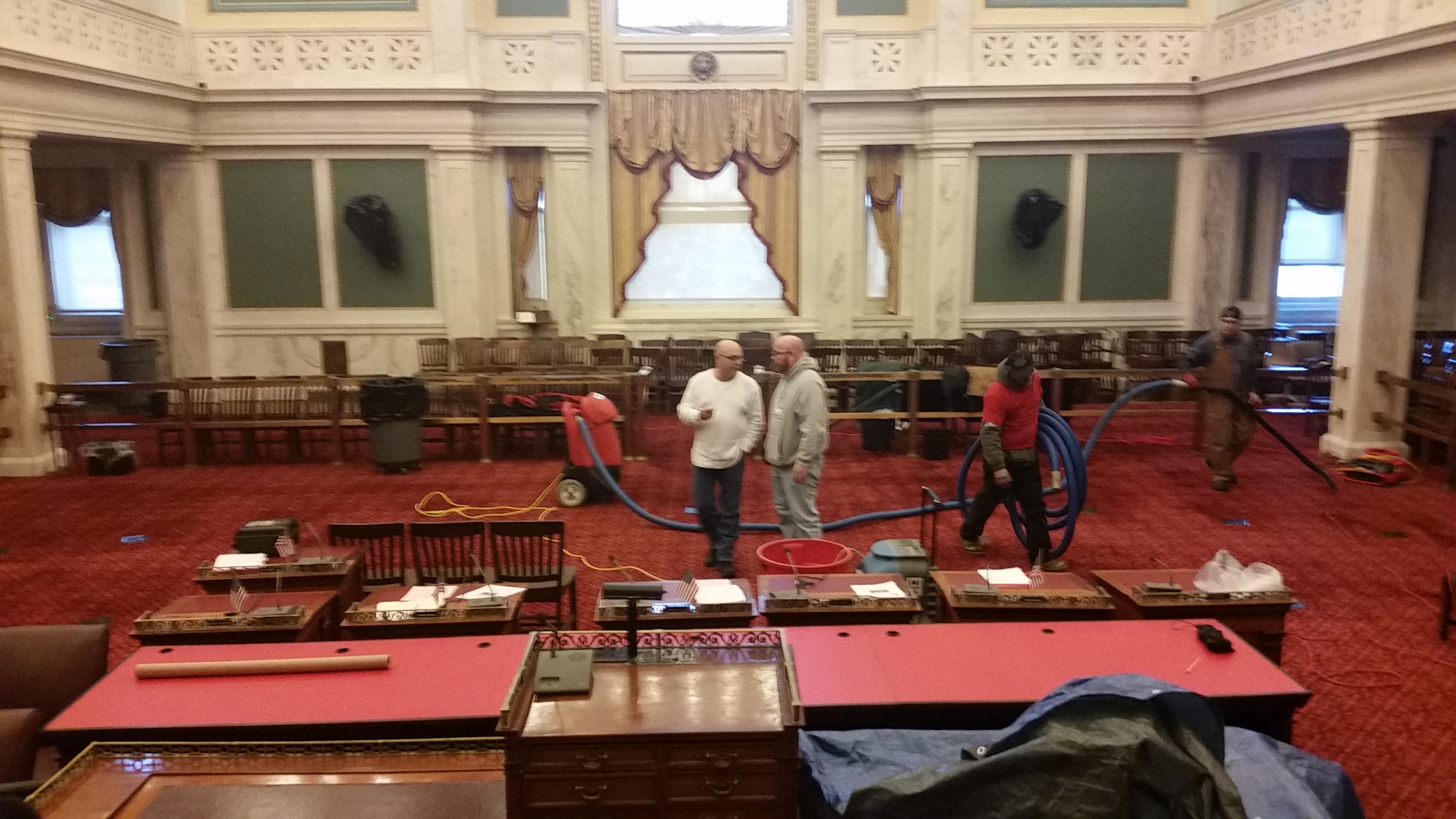  A crew works to clean up Philadelphia City Council chambers. (Tom MacDonald/WHYY) 