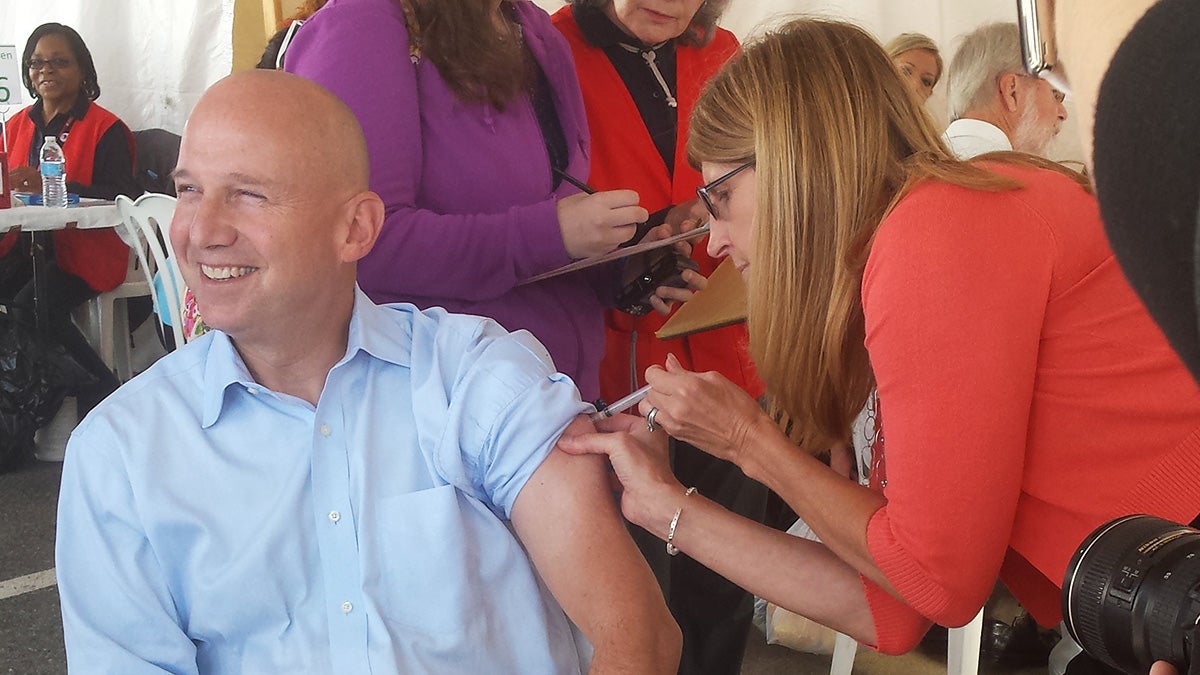  Delaware Governor Jack Markell receiving a flu shot today at the New Castle Farmer's Market (Andrea Gibbs/NewsWorks) 
