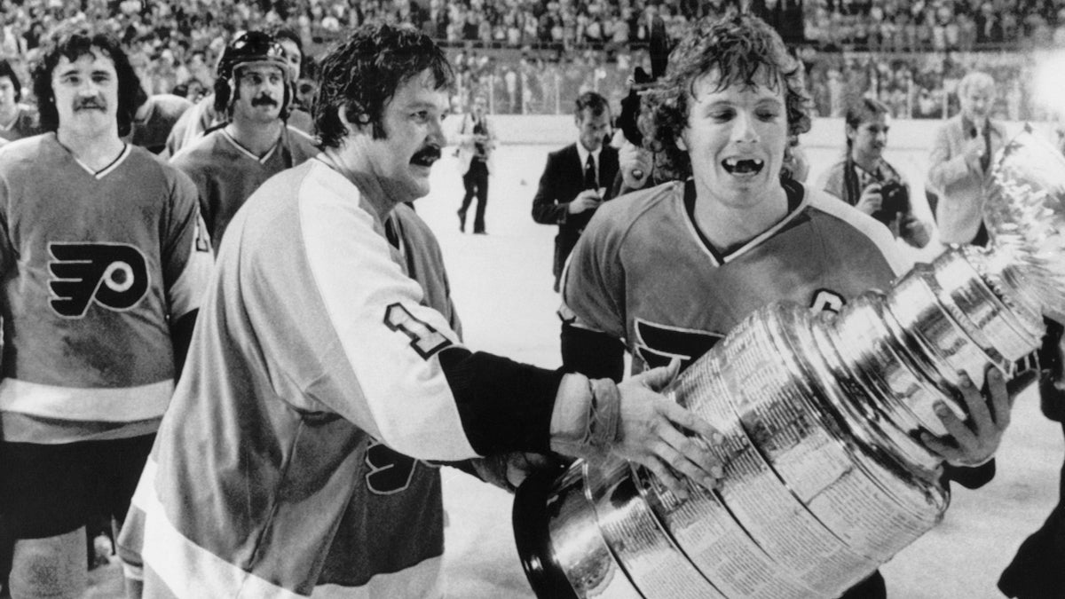  Philadelphia Flyers Bernie Parent, left, and Bobby Clarke, carry the Stanley Cup off the ice in  Buffalo on May 28, 1975, after winning over the Buffalo Sabres. (AP Photo, file) 