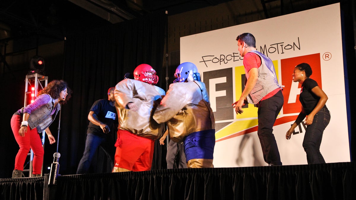  Grover Washington Jr. Middle School teachers Alison Barnes and Gwen Huett don sumo suits to explain basic physics to fifth grade students as part of the 