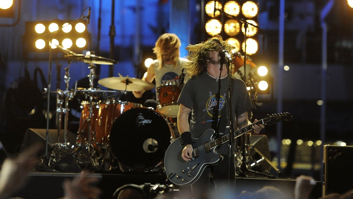 Taylor Hawkins (back) and Dave Grohl of Foo Fighters performing. (AP Photo/Matt Sayles) 