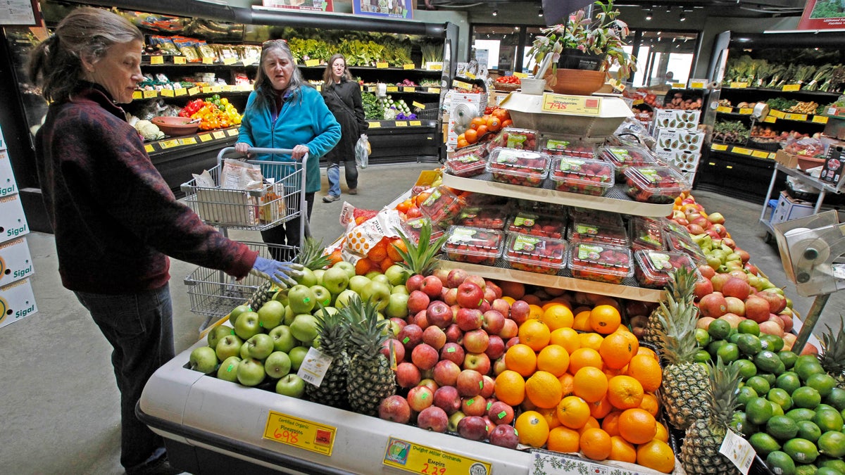 Customers are shown shopping for produce at the Hunger Mountain Co-op in Montpelier, Vt. (AP Photo/Toby Talbot, file) 