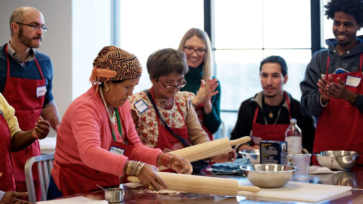  Teela Magar and Cing Neam prepare the roti dough. (Bastiaan Slabbers/for NewsWorks) 