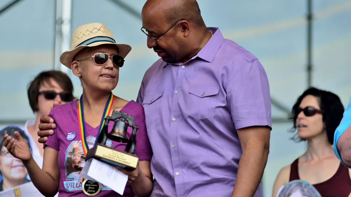  Gloria Casarez is joined on stage by Mayor Michael Nutter at the Philadelphia Pride Parade in June. (Bas Slabbers/for NewsWorks) 